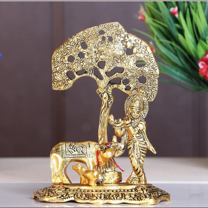 Fashtales Handicrafts Home Decor & Gifts Metal Krishna With Cow Standing Under Tree Plying Flute (Gold, 12.5X8X16Cm), 1 Piece