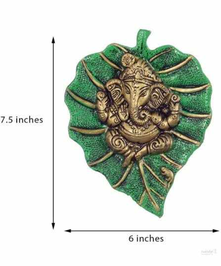 Ganesh ji sits on green color pipal leaf wall hanging for home, office, temple, room decor 20cm (metal, gold & green) handmade