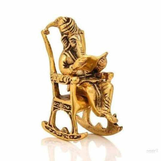 Ganesh sitting on chair reading Idol for home, office, temple, gifting purpose, decorative showpiece- 15cm (metal,gold) handmade