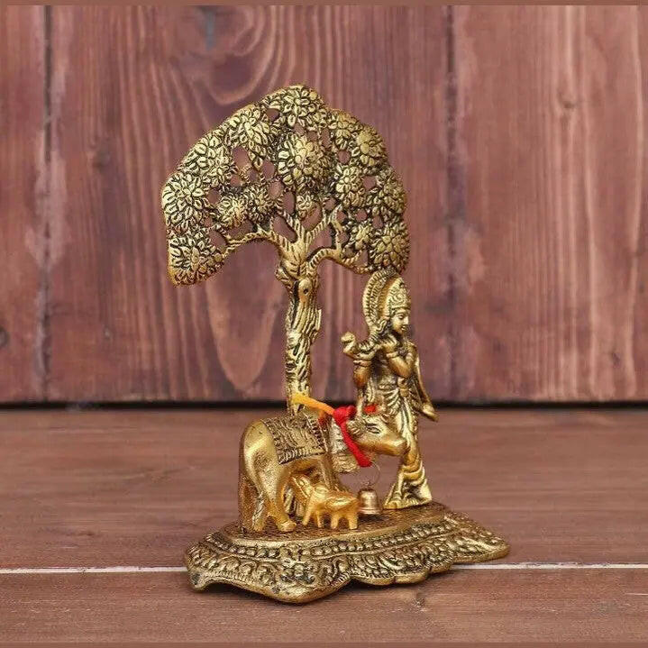 Fashtales Handicrafts Home Decor & Gifts Metal Krishna With Cow Standing Under Tree Plying Flute (Gold, 12.5X8X16Cm), 1 Piece