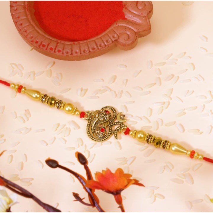 Fashtales Handicrafts Glorious Gold Plated Auspicious and Diamond Ring Rakhi with Roli Chawal and Greeting Card