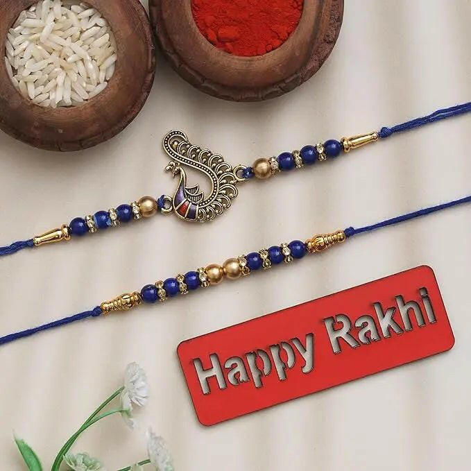 Fashtales Handicrafts Set of 2 Blue & Golden Pearls and Peacock Designer Rakhis with Roli Chawal Pack and Happy Rakhi Wooden Cutout - Rakhi for Brother, Bhaiya, Bhai